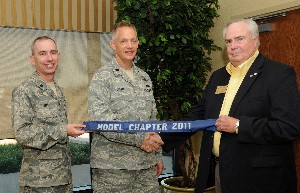 In September, Lt. Col. Trevor Wall, USAF (l), chapter vice president, and Lt. Col. Douglas Short, USAF (c), chapter president, accept the AFCEA Model Chapter Award from Tom Gwaltney, regional vice president.